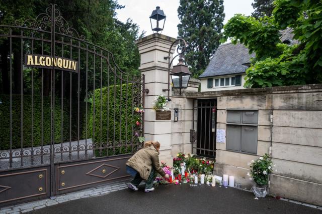 A mourner lays flowers outside the estate of late singer Tina Turner in Kusnacht (AFP via Getty Images)