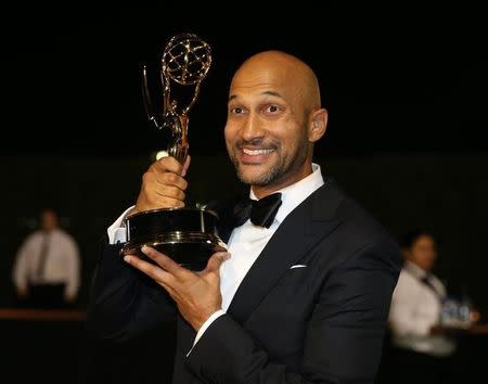 Keegan-Michael Key holds the award for Outstanding Variety Sketch Series for "Key & Peele" as he arrives at the Governors Ball after the 68th Primetime Emmy Awards in Los Angeles, California U.S., September 18, 2016. REUTERS/Lucy Nicholson