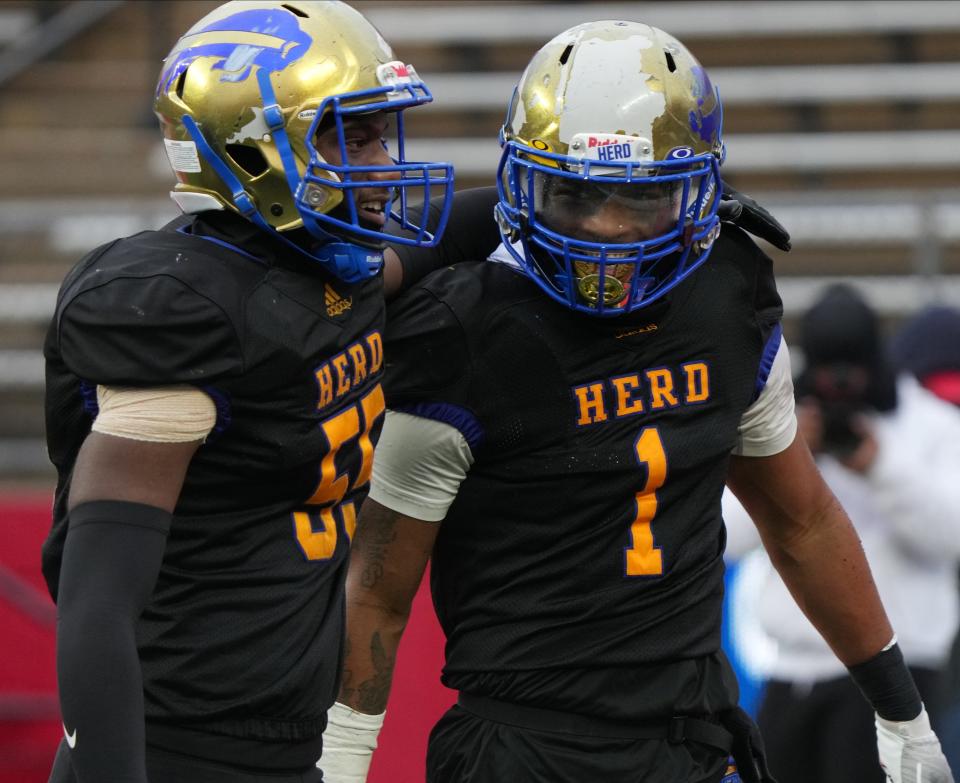 Jasuan Solomon (55) and Derron Moore (1) of Woodbury after Moore scored a TD in the second half as Woodbury defeated Mountain Lakes 31-7 to win the NJSIAA Group 1 Football Championship played in SHI Stadium at Rutgers in Piscataway, NJ in December 3,  2022.