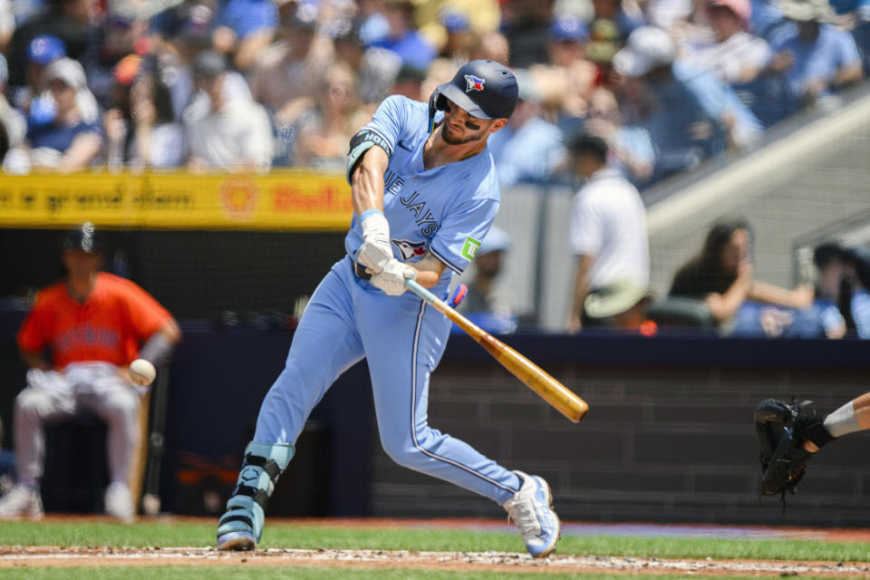 Toronto Blue Jays second baseman Spencer Horwitz singles during the first inning of a baseball game against the Houston Astros in Toronto on Thursday, July 4, 2024. (Christopher Katsarov/The Canadian Press via AP)