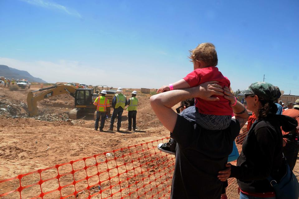 Spectators watch the progress as workers search the old Alamlgordo landfill for buried Atari games in Alamogordo