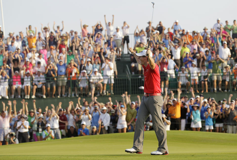 FILE - Rory McIlroy of Northern Ireland reacts to his victory on the 18th green in the final round of the PGA Championship golf tournament on the Ocean Course of the Kiawah Island Golf Resort in Kiawah Island, S.C., in this Sunday, Aug. 12, 2012, file photo. The PGA is limiting attendance at Kiawah this year to 10,000 fans a day. (AP Photo/John Raoux, File)