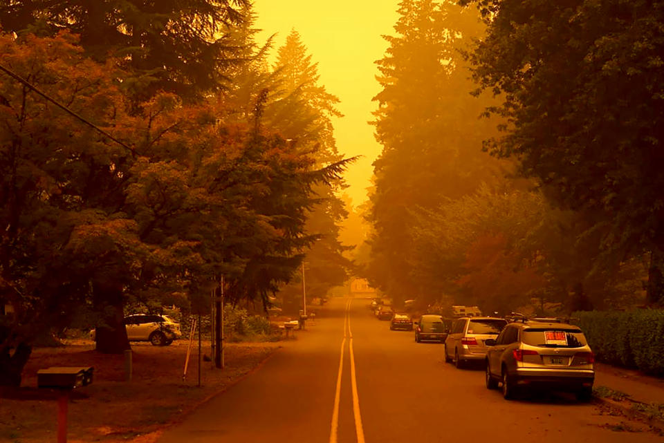 In a photo provided by Christian Gallagher, a street in West Linn, Ore., is shrouded by smoke from wildfires, Thursday, Sept. 10, 2020. (Christian Gallagher via AP)