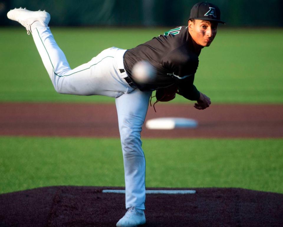 Auburn starter Amari Goodfellow delivers a pitch to a Peninsula batter during the bottom of the third inning of the 3A District 3/4 championship game on Saturday, May 14, 2022, at Auburn High School in Auburn, Wash.