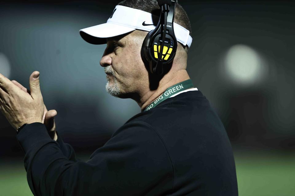 Mason coach Brian Castner cheers on his team during a playoff game between Mason and Moeller high schools on Friday, Nov. 11, 2022.