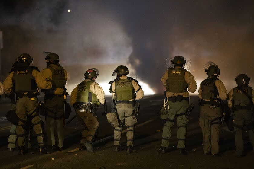 Los Angeles, CA SEPTEMBER 8, 2020: A few people were taken into custody after the Los Angeles Sheriff's Department Declared an unlawful assembly and moved towards a crowd that gathered near the corner of Imperial Hwy and Normandy in Los Angeles, CA September 8, 2020. There have been three straight nights off protest outside the South LA Sheriff's station following the deadly deputy involved shooting of Dijan Kizzee. (Francine Orr/ Los AngelesTimes)