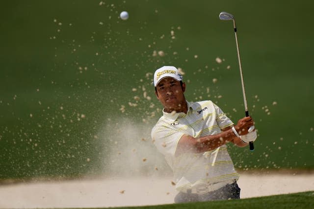 Hideki Matsuyama hits out of a bunker during the final round of the Masters