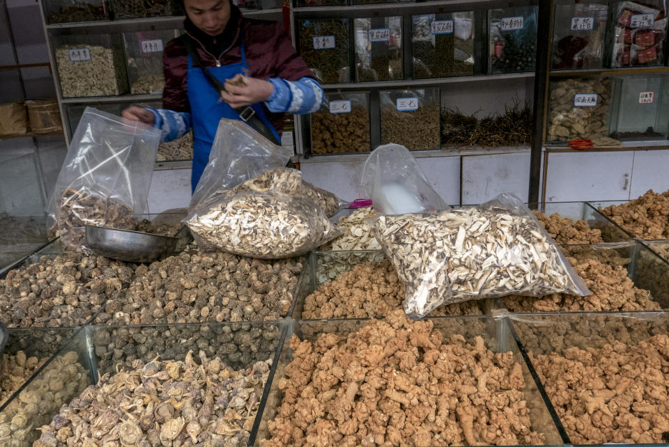 LIJIANG, YUNNAN PROVINCE, CHINA - 2015/12/04: Stall selling Maca, which is very popular used as a root vegetable and a medicinal herb.  Zhongyi market, located at the southern gate of Dayan ancient city,  is the biggest market in Lijiang selling local produce, copper items and livestock, where visitors can get close to the vivid daily life of Naxi people. (Photo by Zhang Peng/LightRocket via Getty Images)