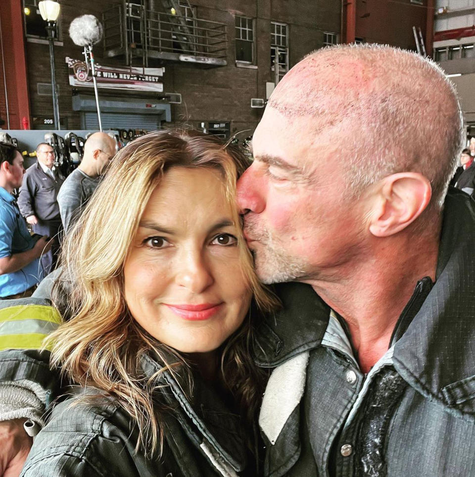 Mariska Hargitay and Christopher Meloni shared a moment in the midst of becoming firefighters for a day for a charitable cause.  (@therealmariskahargitay via Instagram)