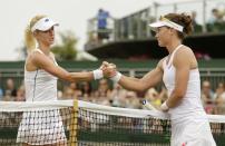 Samantha Stosur of Australia shakes hands with Urszula Radwanska of Poland after winning their match at the Wimbledon Tennis Championships in London, July 1, 2015. REUTERS/Henry Browne