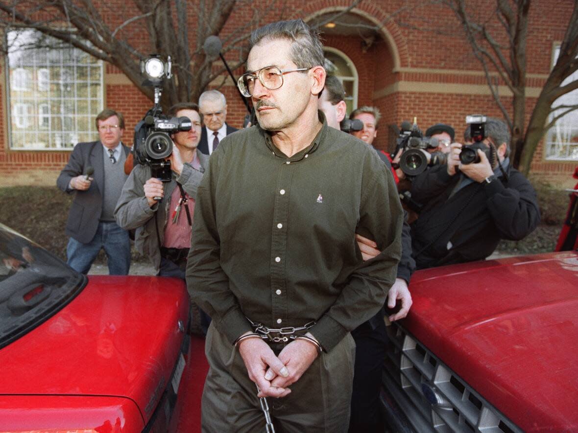 Aldrich Ames is seen leaving a U.S. federal courthouse in Alexandria, Va., on Feb. 22, 1994, after being arraigned on charges of spying for the former Soviet Union. The CIA officer later pleaded guilty to espionage and continues to serve a life sentence at a U.S. federal penitentiary in Indiana. (Luke Frazza/AFP/Getty Images - image credit)