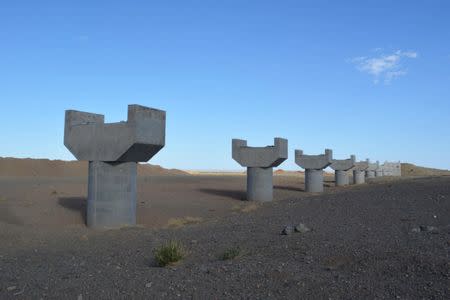 FILE PHOTO: An unfinished bridge on the road between the coal mines of Tsogttsetsii and the border to China is seen in Tsogttsetsii, Mongolia, June 12, 2017. REUTERS/Terrence Edwards