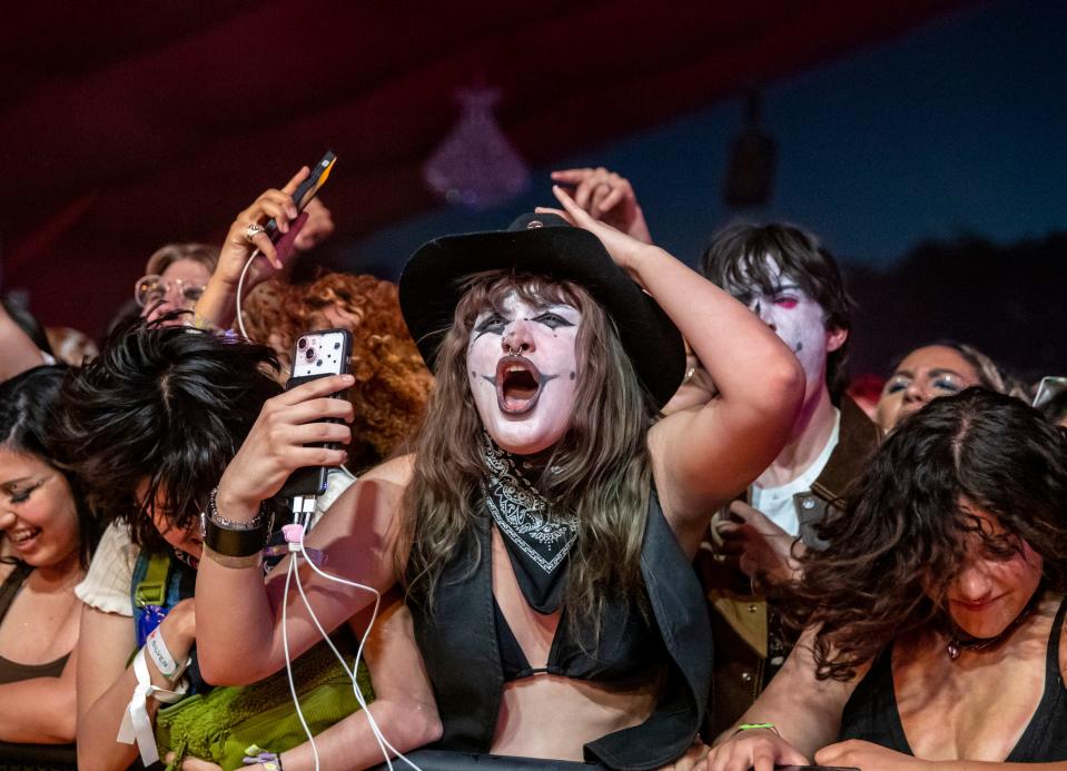 Festivalgoers dance and sing along to The Garden as they perform at the Gobi tent during the Coachella Valley Music and Arts Festival at the Empire Polo Club in Indio, Calif., Friday, April 21, 2023.
