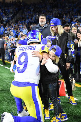 <p>Steven King/Icon Sportswire via Getty</p> Matthew Stafford hugs his kids on the sidelines