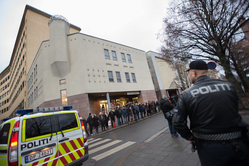 Police blocked streets as hundreds of Norwegians of all faiths and ethnicities linked hands.