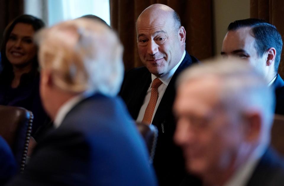 US President Donald Trump (L) turns to outgoing National Economic Council chairman Gary Cohn (C) during a Cabinet meeting in the Cabinet Room of the White House on March 8, 2018 in Washington, DC. / AFP PHOTO / MANDEL NGAN        (Photo credit should read MANDEL NGAN/AFP via Getty Images)