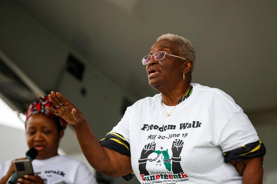 Vivian Filer leads the crowd in singing "Lift Every Voice and Sing" ahead of the Journey to Juneteenth Freedom Walk at Depot Park on June 19, 2021 in Gainesville. The walk will be held again this year at Depot Park.