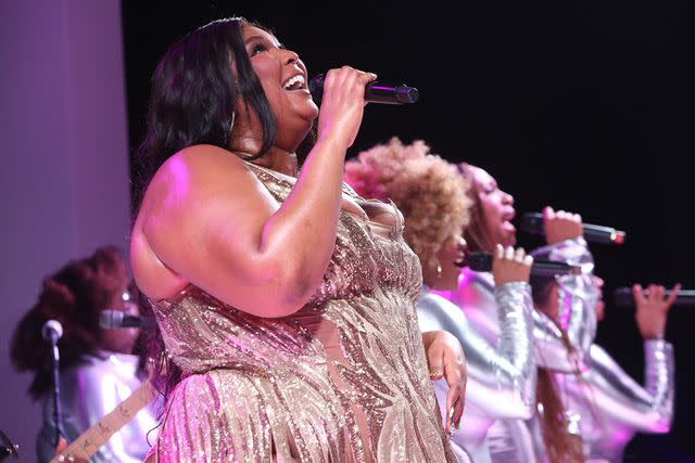 <p>Adam Berry/Getty Images for iHeartMedia</p> Lizzo performing in June 2023