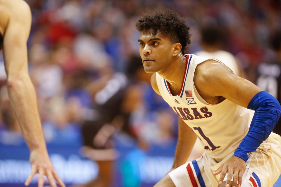 Kansas guard Remy Martin (11) watches closely as a Stephen F. Austin player dribbles down court during the second half of Saturday's game inside Allen Fieldhouse.