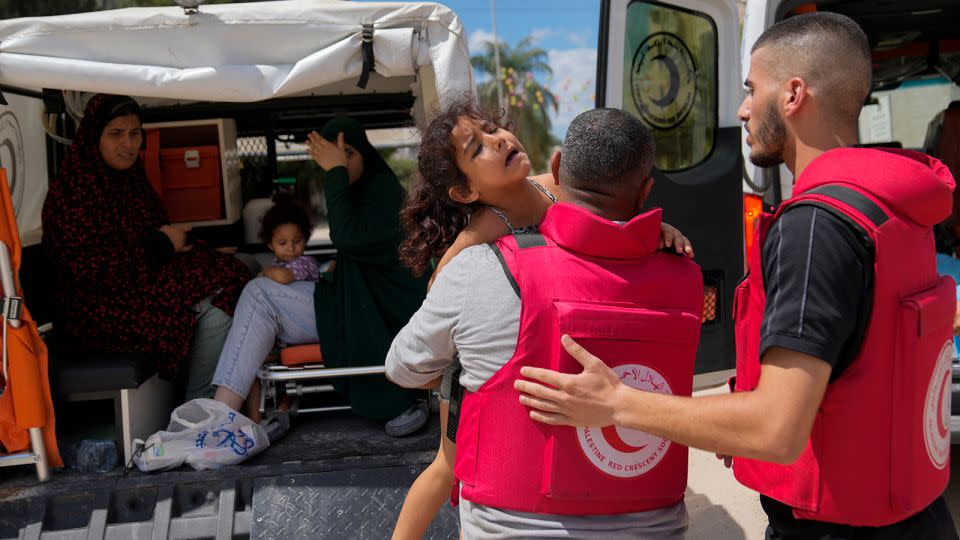 Palestinian paramedics help to evacuate residents during an Israeli military operation in Tulkarem, West Bank, on Wednesday. - Nasser Nasser/AP