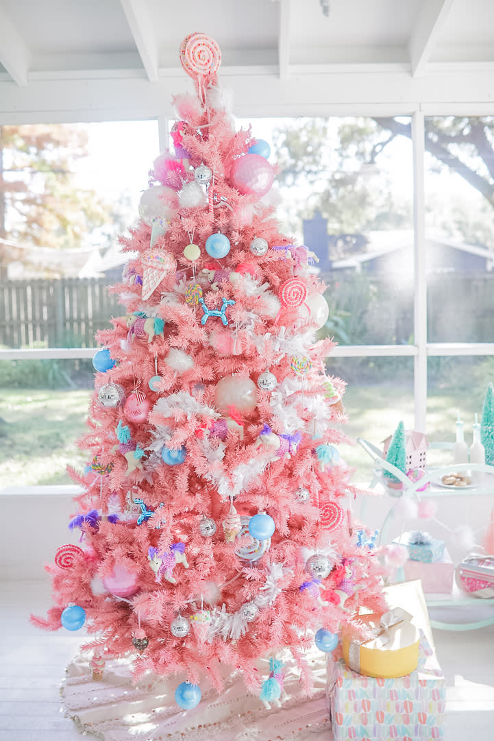 <p>This pretty-in-pink tree features treats like ice cream and lollipops for sweetness and disco-ball ornaments for sparkle. Blogger <a rel="nofollow noopener" href="https://www.instagram.com/cakeandconfetti/" target="_blank" data-ylk="slk:Meredith Timms Staggers;elm:context_link;itc:0;sec:content-canvas" class="link ">Meredith Timms Staggers</a> came up with the idea for her daughter’s backyard birthday party (complete with fake snow and a shed-turned-gingerbread house).<br>(Photo courtesy of Meredith Timms Staggers) </p>