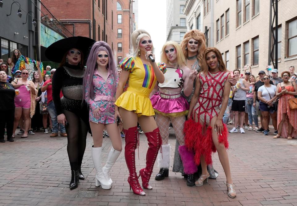 June 8, 2024; Columbus, Ohio, USA; 
Drag queens Miss Avarice, Maya Mortal, Blonde Vanity, Cloe Angel, Eden Apple and Godiva pose in Pearl Alley during the Downtown Pride festival Saturday evening.