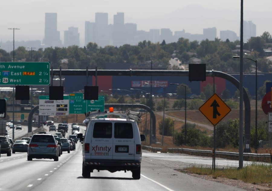 pollution shrouds the skyline of downtown Denver