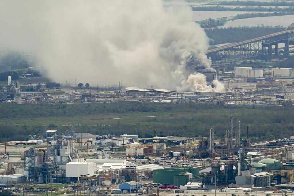 A chemical fire burns at a facility during the aftermath of Hurricane Laura Thursday, Aug. 27, 2020, near Lake Charles, La. (AP Photo/David J. Phillip)