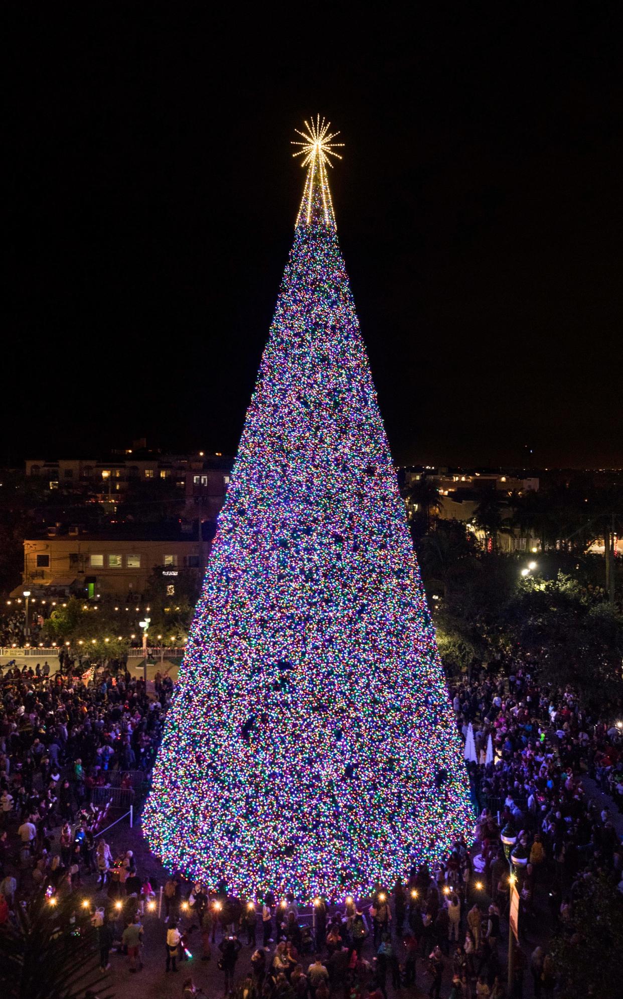 Delray Beach's massive 100-foot Christmas tree will be lit on Nov. 28 and coincide with their Yuletide Street Fair.