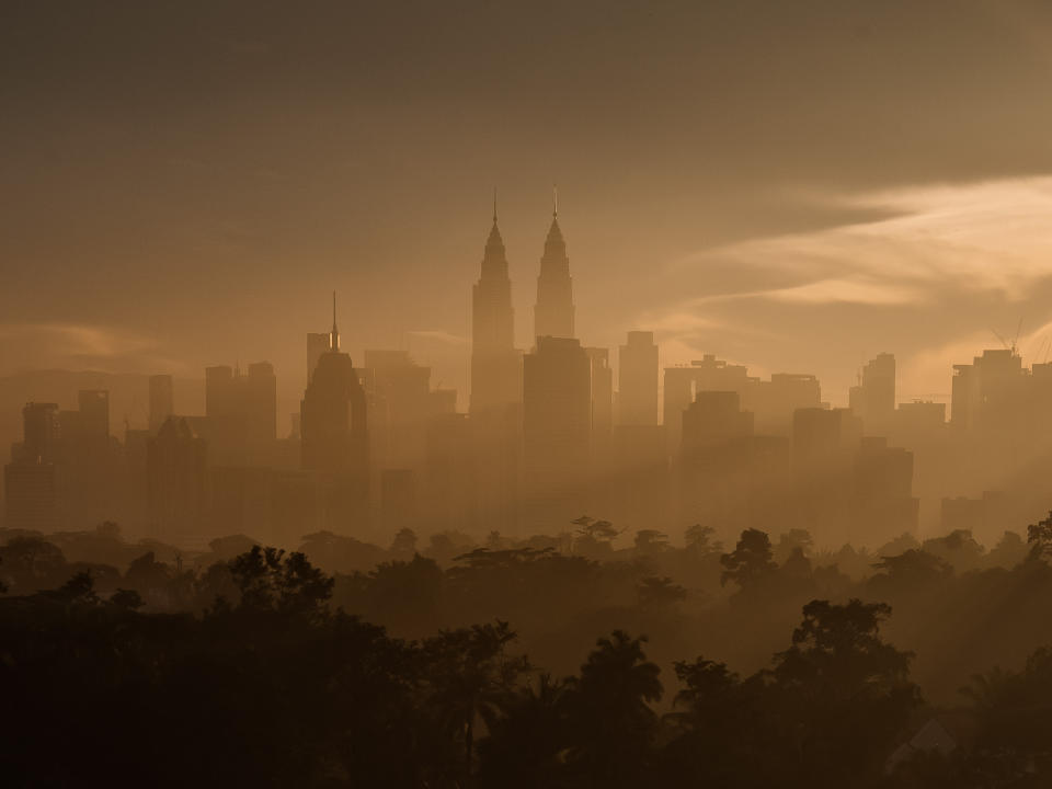 Misty morning during sunrise in Kuala Lumpur with Petronas Twin Tower.