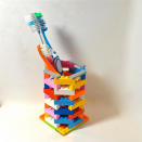 <div class="caption-credit"> Photo by: Etsy</div><div class="caption-title">LEGO Toothbrush Holder</div>This one is so simple yet so very practical! Constructing it won't take long, and its design is much cooler than that of a traditional plastic or glass toothbrush holder. <br> <i><a href="http://www.babble.com/mom/20-wacky-yet-practical-items-made-of-legos/?cmp=ELP|bbl|lp|YahooShine|Main||011013||20wackyyetpracticalitemsmadeoflegos|famE|||" rel="nofollow noopener" target="_blank" data-ylk="slk:Get it from Etsy seller ValGlaser, $25" class="link ">Get it from Etsy seller ValGlaser, $25</a></i>