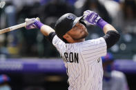 Colorado Rockies' Garrett Hampson flies out in the fifth inning of a baseball game Sunday, April 18, 2021, in Denver. (AP Photo/David Zalubowski)