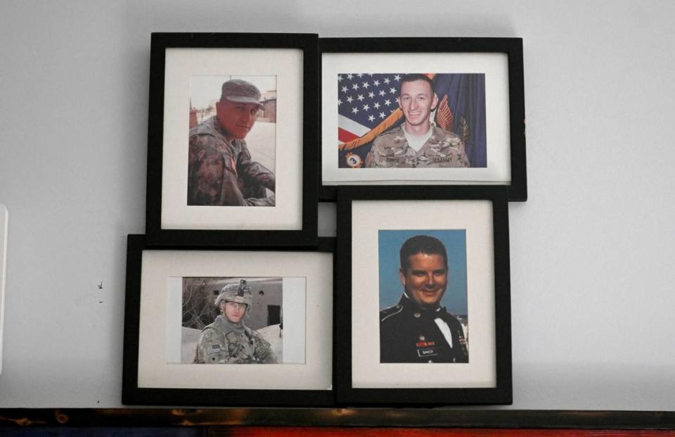 A collage on the wall of Adam Hartswick’s home honors the men who were killed on May 14, 2013, SPC William J Gilbert, SPC Cody J Towse, SPC Mitchell K Daehling, and SFC Jeffrey C Baker.
