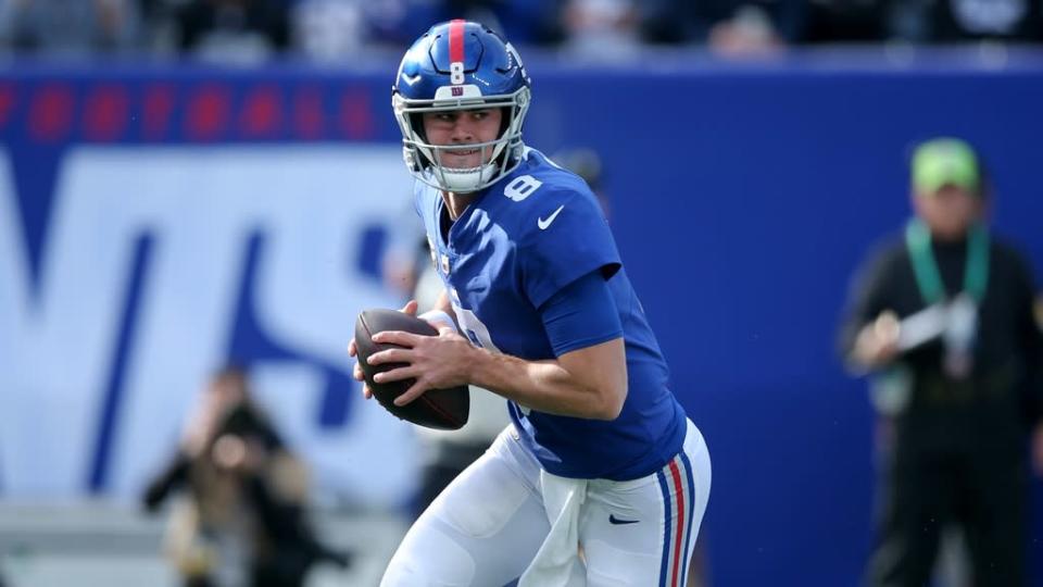 Nov 7, 2021; East Rutherford, New Jersey, USA; New York Giants quarterback Daniel Jones (8) rolls out of the pocket to pass against the Las Vegas Raiders during the first quarter at MetLife Stadium. Mandatory Credit: Brad Penner-USA TODAY Sports