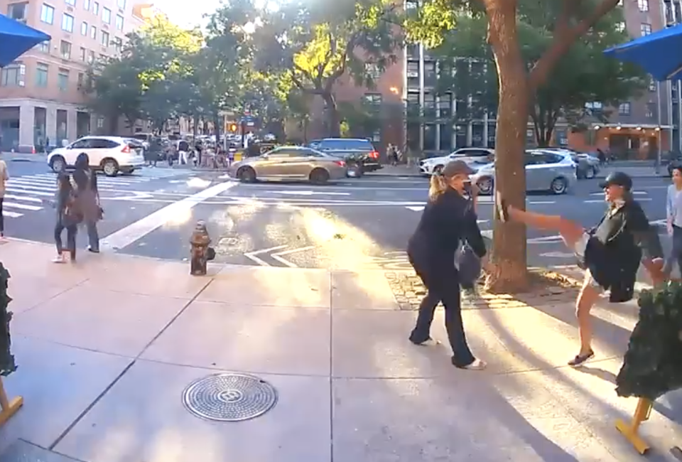 A woman kicks another woman in Manhattan, New York.