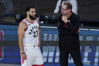 Toronto Raptors' head coach Nick Nurse, right, speaks with Fred VanVleet during the second half of an NBA basketball game against the Los Angeles Lakers, Saturday, Aug. 1, 2020, in Lake Buena Vista, Fla. (AP Photo/Ashley Landis, Pool)