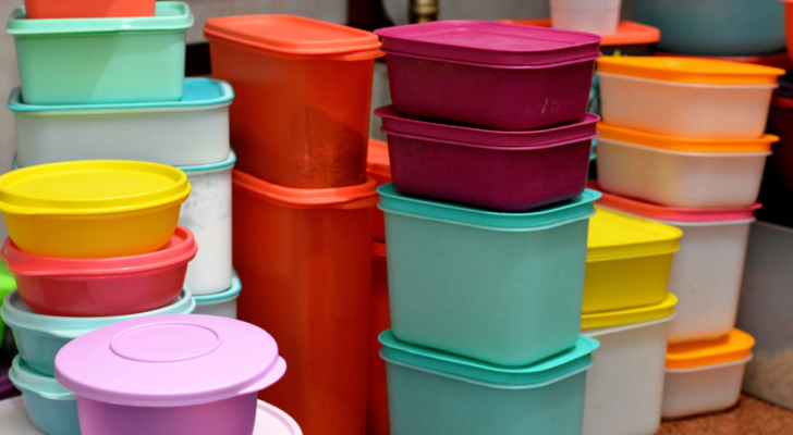 Pile of several and many Tupperware plastic products, Tupperware Corporation, (TUP) an American multinational company produces plastic food storage containers and bottles