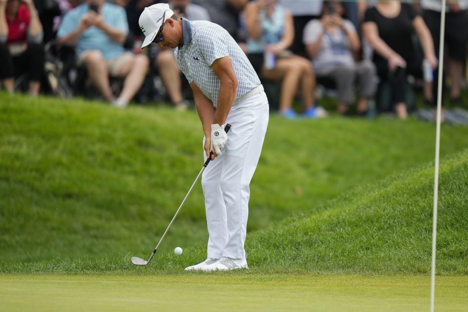 Rickie Fowler chips from the rough on the ninth green during the third round of the Travelers Championship golf tournament at TPC River Highlands, Saturday, June 24, 2023, in Cromwell, Conn. (AP Photo/Frank Franklin II)