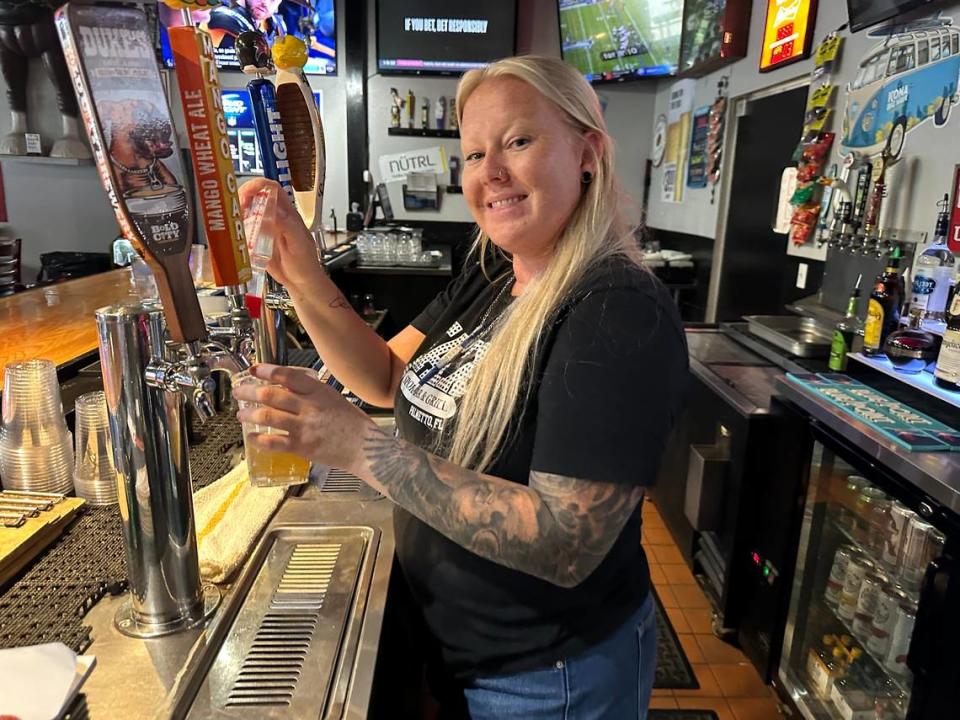 Jessie Johnson tends bar at Jaxx Sports Bar & Grill, 1035 Hasko Road, Palmetto, in Palm Plaza 1.