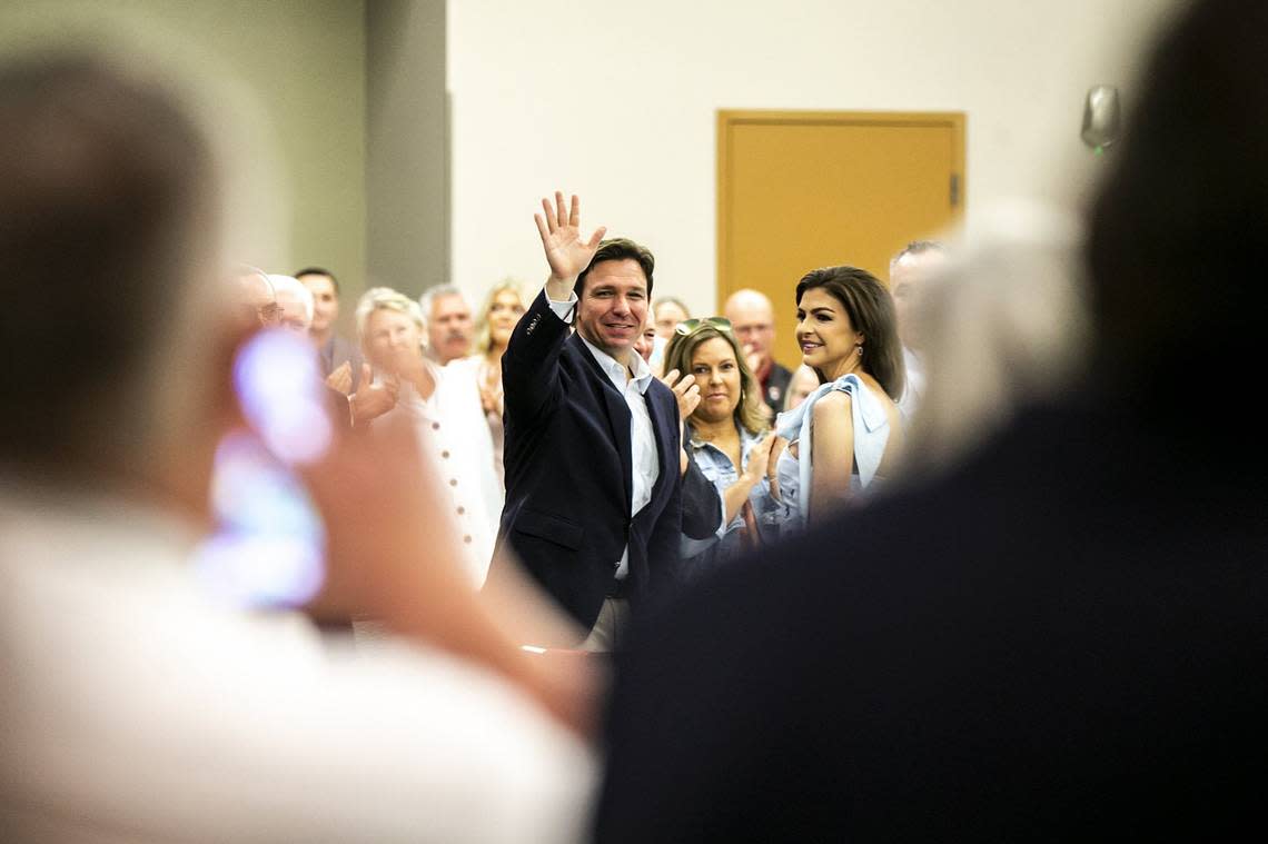 May, 14, 2023; Cedar Rapids, IA, USA; Florida Gov. Ron DeSantis, left, and his wife Casey DeSantis are acknowledged by the crowd during an Iowa GOP reception, Saturday, May 13, 2023, at The Hotel at Kirkwood Center in Cedar Rapids, Iowa. Mandatory Credit: Joseph Cress-USA TODAY NETWORK