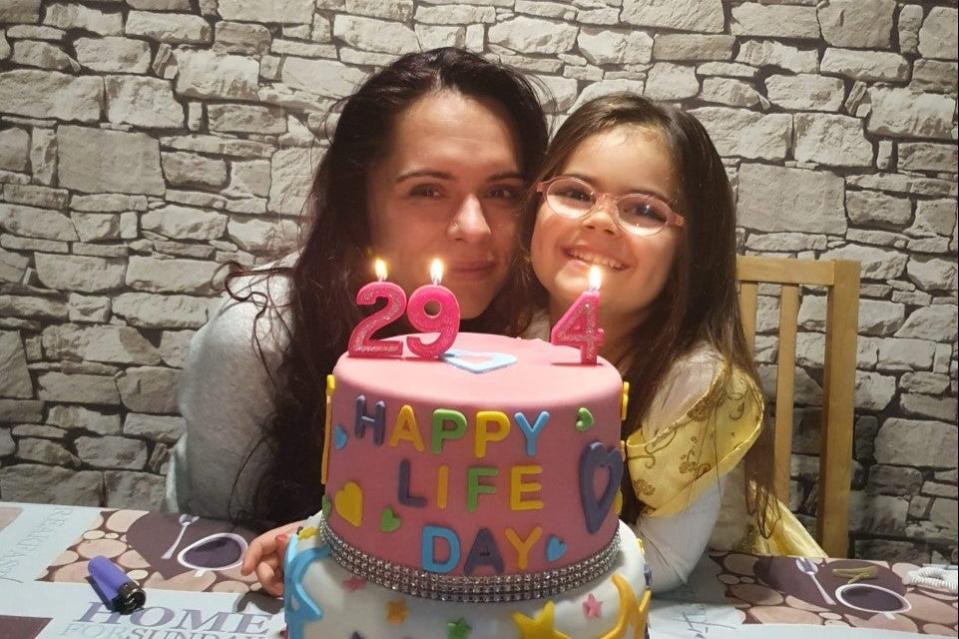 <p>Sarah Bostan, now four, and her mother Maria-Luiza Prioteasa</p> (Handout)