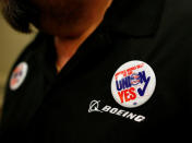 Boeing worker Jerry Guerena of Charleston, wears a button in support during a rally held by the International Association of Machinists and Aerospace Workers for Boeing South Carolina workers before Wednesday's vote to organize, in North Charleston, South Carolina, U.S. February 13, 2017. REUTERS/Randall Hill