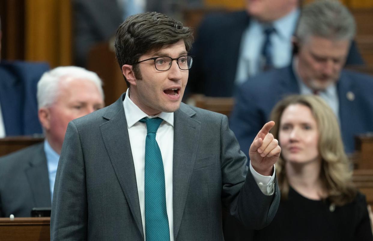 Conservative MP for Sherwood Park-Fort Saskatchewan Garnett Genuis rises during question period in Ottawa on Monday, April 15, 2024.  (Adrian Wyld/Canadian Press - image credit)