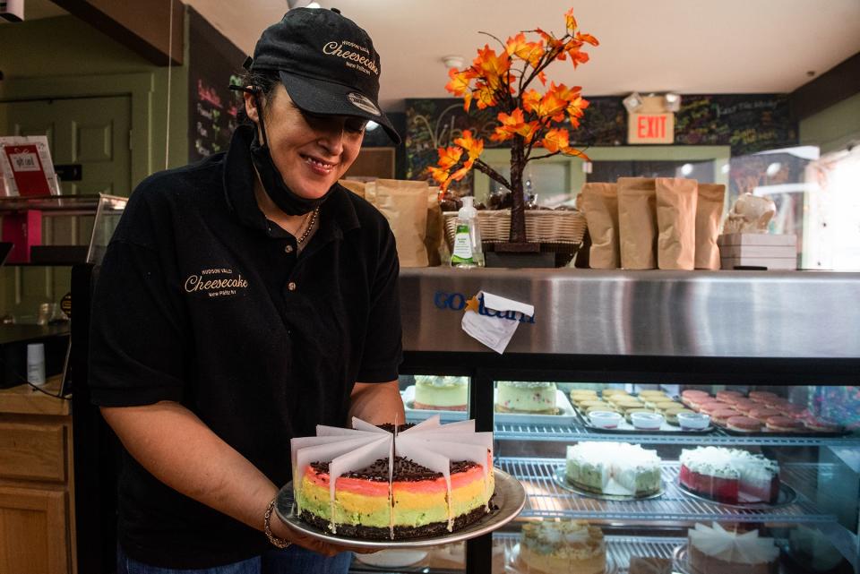 Dana Charres, owner of Hudson Valley Cheesecake, shows the most popular cheesecake, the signature rainbow cookie cheesecake at Hudson Valley Cheesecake in New Paltz, NY on Thursday, October 21, 2021. K