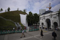 A view of the newly built "Marble Arch Mound" after it was opened to the public next to Marble Arch in London, Tuesday, July 27, 2021. The temporary installation commissioned by Westminster Council and designed by architects MVRDV has been opened as a visitor attraction to try and entice shoppers back to the adjacent Oxford Street after the coronavirus lockdowns. (AP Photo/Matt Dunham)
