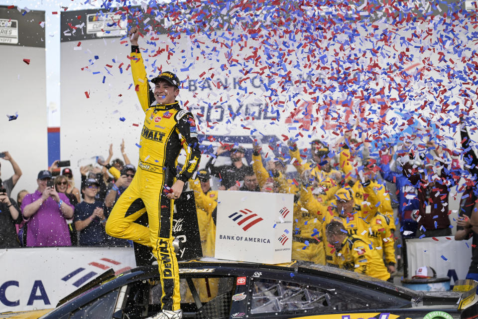 Christopher Bell celebrates in Victory Lane after winning a NASCAR Cup Series auto race at Charlotte Motor Speedway, Sunday, Oct. 9, 2022, in Concord, N.C. (AP Photo/Matt Kelley)