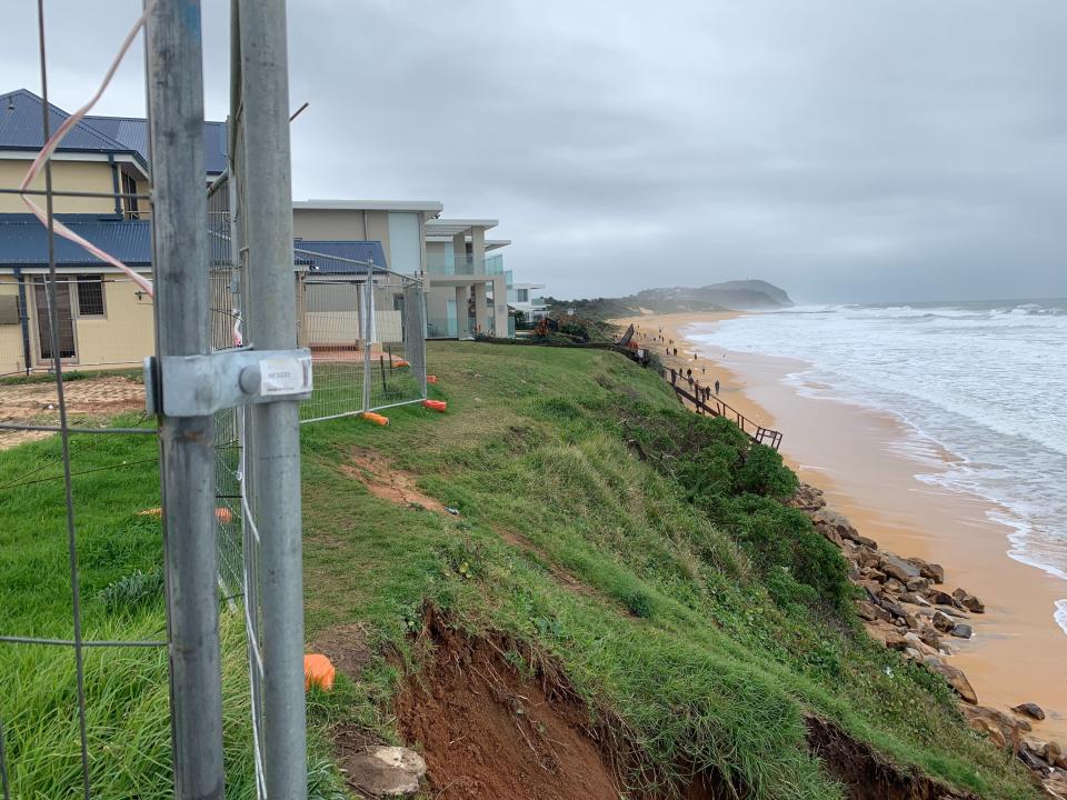 Pictured is a side view of homes showing how close they are to the edge of the dune.