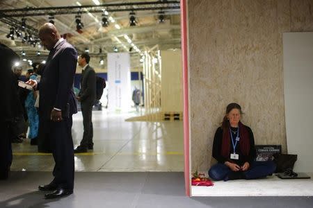 A participant mediates at the World Climate Change Conference 2015 (COP21) at Le Bourget, near Paris, France, December 12, 2015. REUTERS/Stephane Mahe