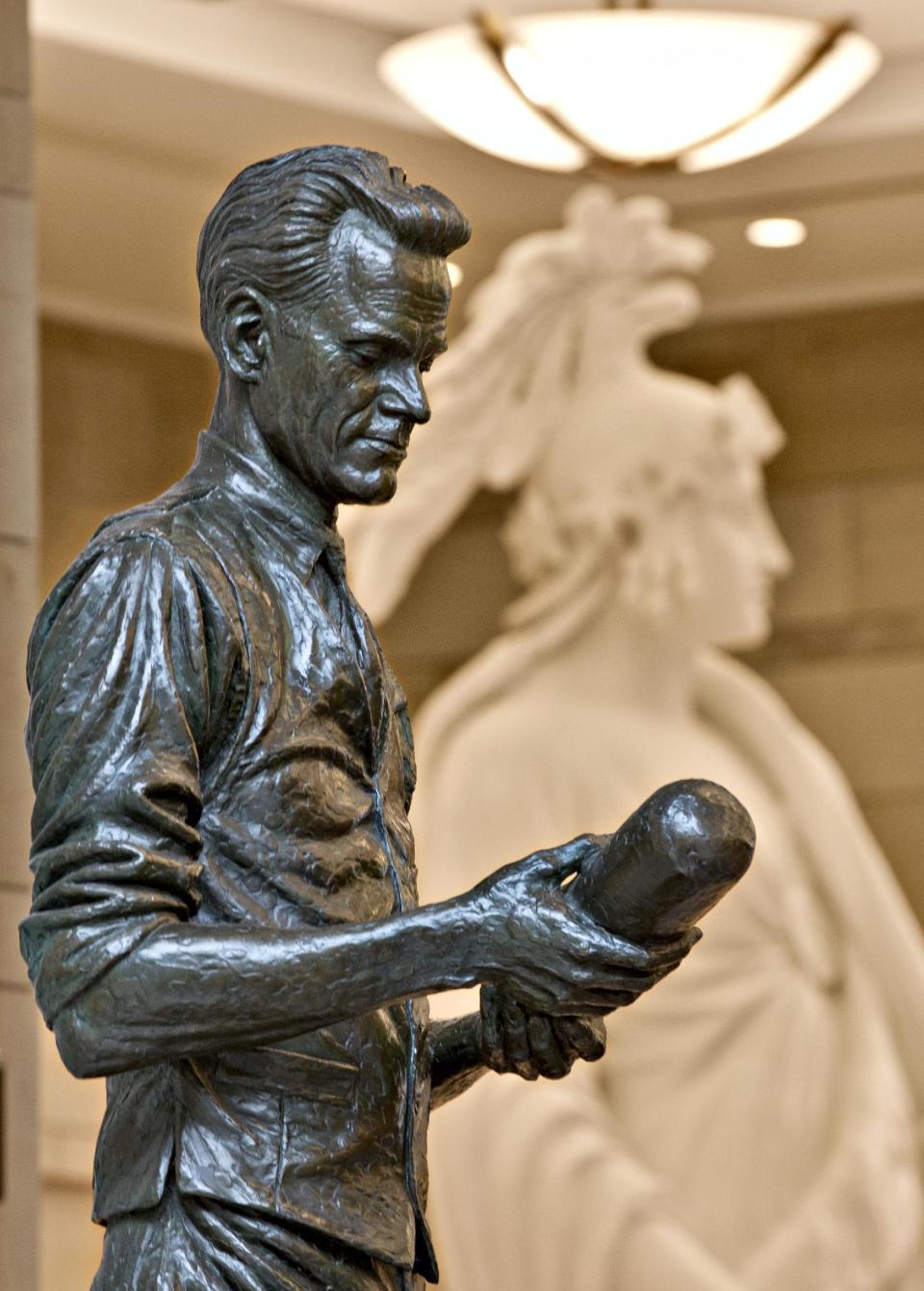 Utah's Philo T. Farnsworth, known as the "father of television," is depicted in bronze by sculptor James R. Avati holding a cathode ray tube, at the Capitol Visitors Center in Washington, Tuesday, July 2, 2013. All summer, thousands of visitors traipse among the U.S. Capitol’s many statues, which honor the nation’s founders, leaders and legends. (AP Photo/J. Scott Applewhite)