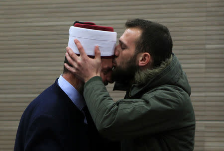 The Basic Court of Pristina delivers a verdict against the imam of the grand mosque Shefqet Krasniqi (L), who was indicted of influencing young Kosovars into joining radical Islamic groups through his lectures, in Pristina, Kosovo March 23, 2018. REUTERS/Hazir Reka